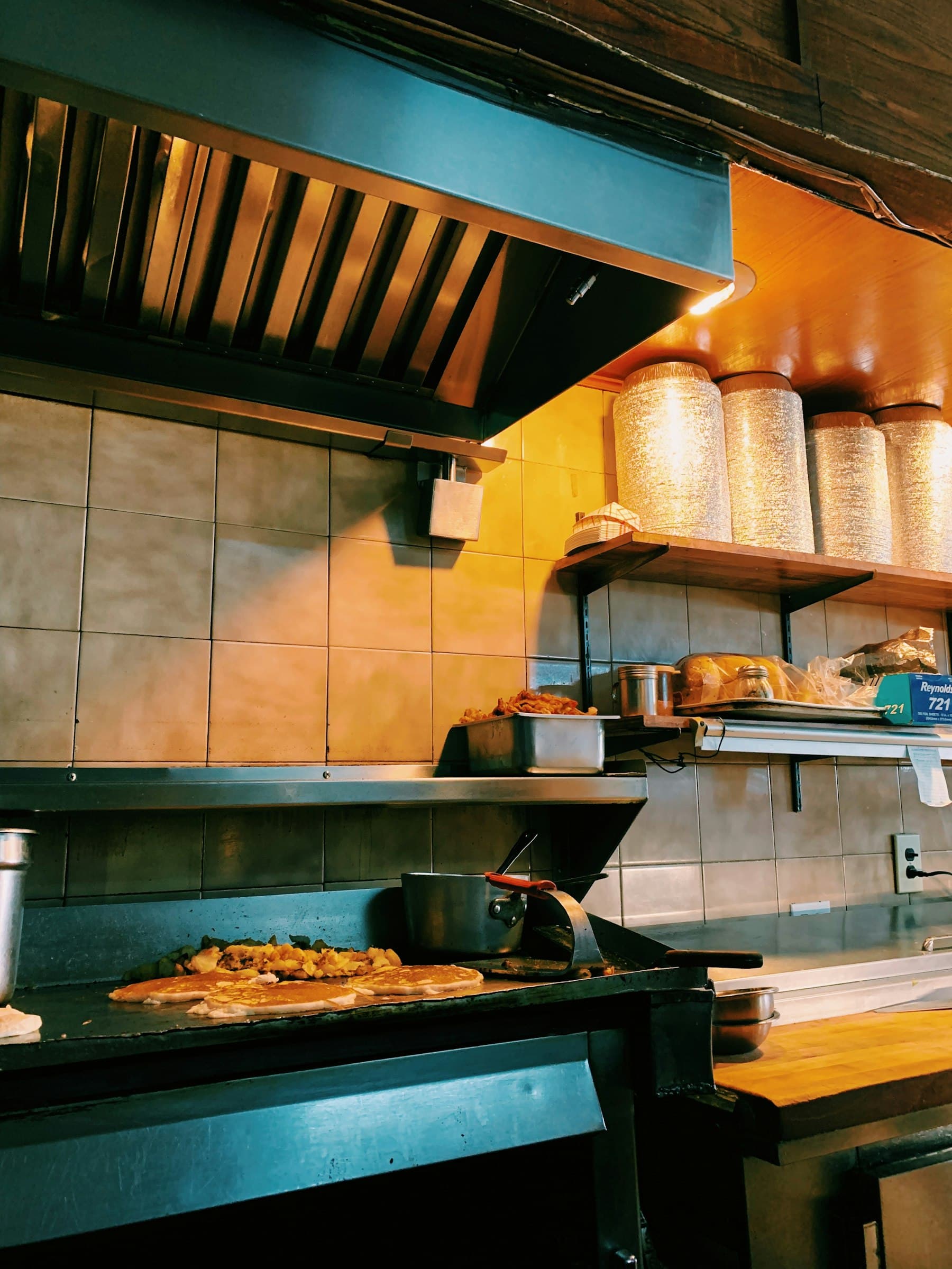 Exhaust hood above a restaurant griddle